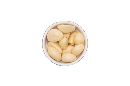 Minced and peeled garlic on a white backgroundの写真素材