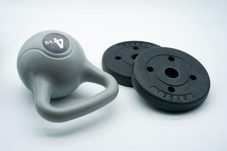 Home gym concept with kettlebells and dumbbellsの写真素材