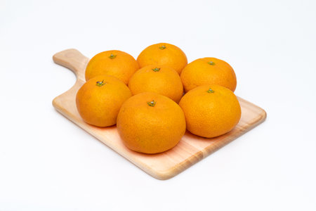 Sweet and delicious looking tangerines concept on white backgroundの写真素材