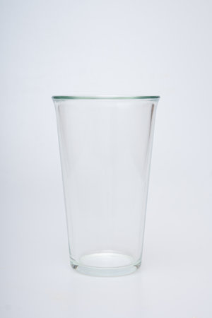 Glasses of various shapes on a white backgroundの写真素材