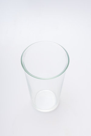 Glasses of various shapes on a white backgroundの写真素材
