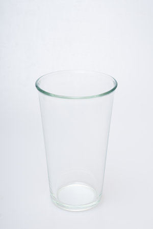 Glasses of various shapes on a white backgroundの写真素材