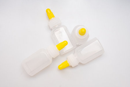 Children's medical potion bottles on a white backgroundの写真素材