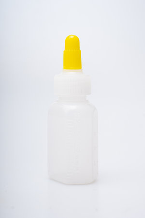 Children's medical potion bottles on a white backgroundの写真素材