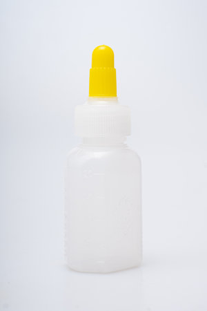 Children's medical potion bottles on a white backgroundの写真素材