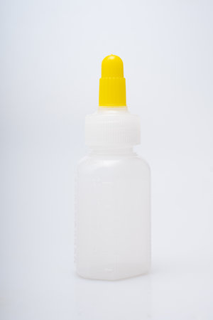 Children's medical potion bottles on a white backgroundの写真素材