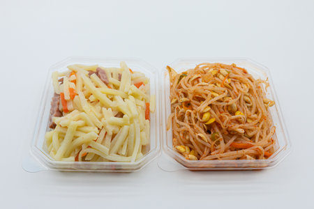 Thai food, papaya salad in plastic box on white backgroundの写真素材