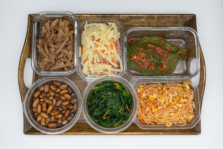 Plastic containers with different kinds of food on the white background.の写真素材