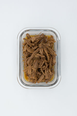 Canned beef in a plastic container on a white background, top viewの写真素材