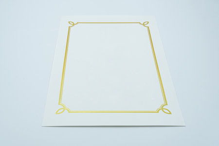 Gold frame on a white background. Template for the design of a greeting card.の写真素材