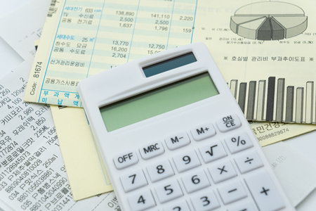 Calculator and financial documents on the table, business concept.の写真素材