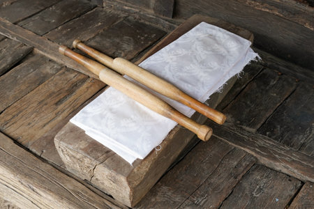 Vintage wooden chopsticks and napkin on old wooden table.の写真素材