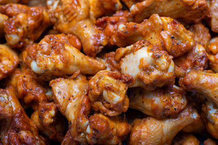 Close up of chicken wings with spicy sauce in a street food stallの写真素材