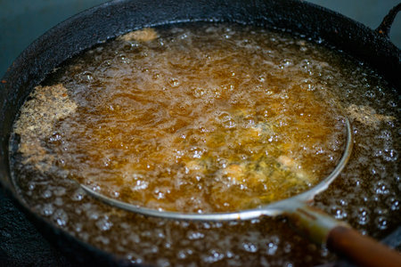 Various kinds of delicious-looking tempura fried in high-temperature oilの写真素材