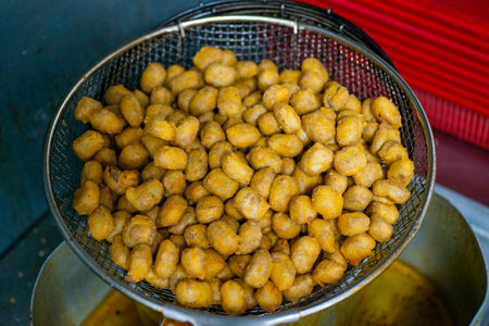 Various kinds of delicious-looking tempura fried in high-temperature oilの写真素材