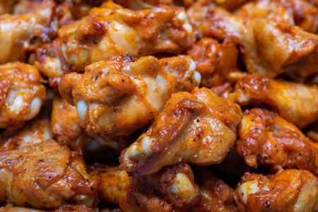 chicken wings in spicy marinade, closeup of photoの写真素材