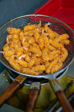 Various kinds of delicious-looking tempura fried in high-temperature oilの写真素材