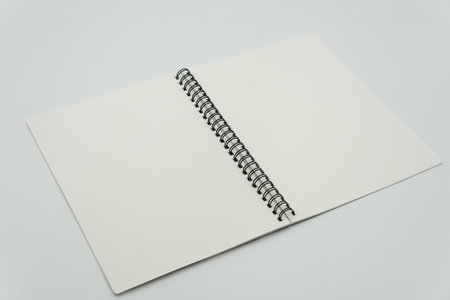 Blank spring note on white backgroundの写真素材