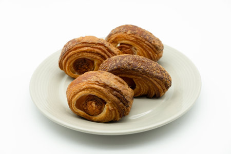 Croissants on a plate on a white background. Isolatedの写真素材