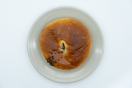 Bread with sesame seeds on a white background, top viewの写真素材