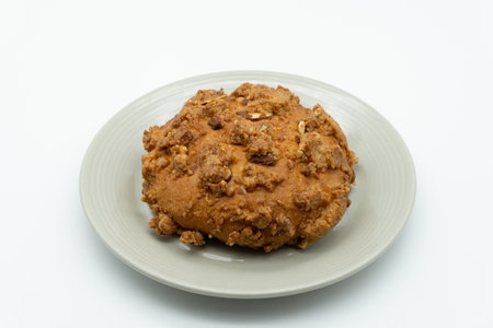 Cookies with nuts on a plate isolated on a white background.の写真素材