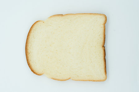 Slice of white bread isolated on white background. Top view.の写真素材