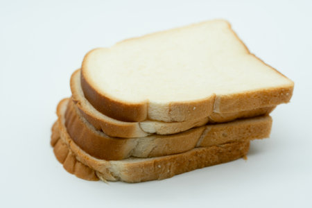 Slices of bread isolated on white background. Close up.の写真素材