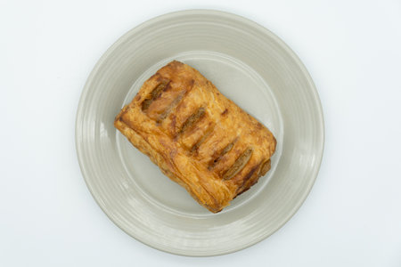 Puff pastry on a plate isolated on white background. Top view.の写真素材