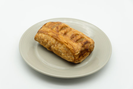 Puff Pastry on a plate isolated on a white background.の写真素材