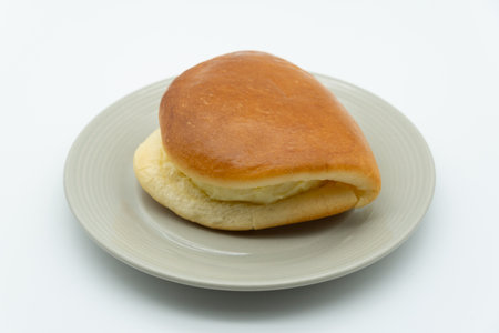 Bread buns on a plate on a white background. Close-up.の写真素材