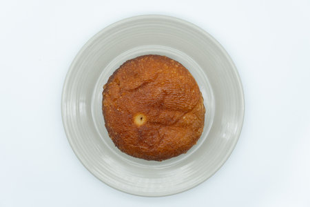 Muffin on a white plate, isolated on white background.の写真素材