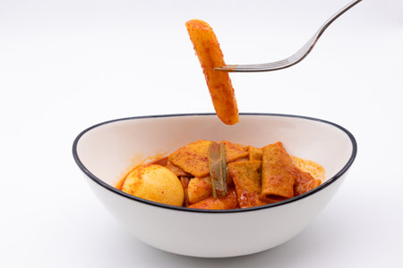 Chicken tikka masala in a bowl on white background.の写真素材