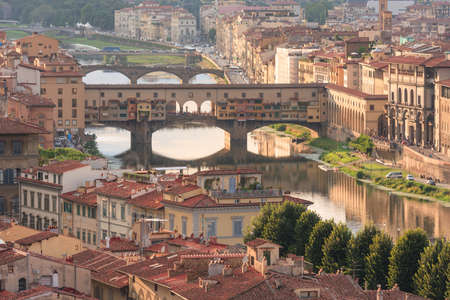 Vecchio Bridge and the Arno River in a late summer afternoon, Florence, Italyの写真素材