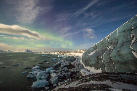 Moon over glacierの写真素材