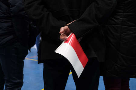 Wloszczowa, Poland - 06 February 2020: portrait of the Polish President Andrzej Duda on the background of Polish white and red flags, at the meeting with votersのeditorial素材