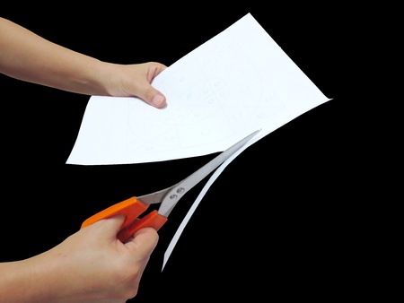 Cutting paper with scissorsの写真素材