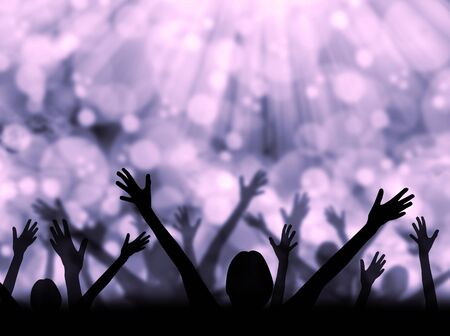 Silhouette of people raising hands on a abstract light backgroundの写真素材