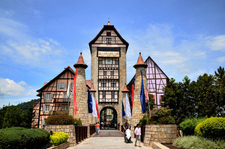 Pahang, Malaysia - April 30, 2012  A man is pushing the pram with his daughter coming out from Colmar Tropical, Bukit Tinggi Resort のeditorial素材