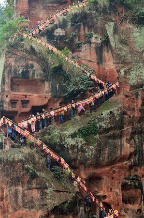 Sichuan,China - October 31, 2013  The tourists are going down to the bottom of the Leshan Giant Buddha traversing through the staircase in cliffside at Sichuan Province in China のeditorial素材