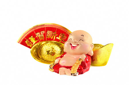Smiling buddha with chinese gold ingots の写真素材