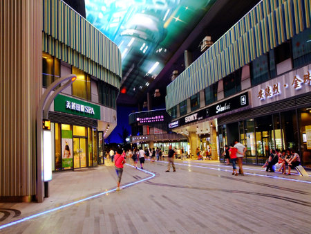 Suzhou,China-September 3,2011 People can seen walking and shopping around the Suzhou Time Square,China at nightのeditorial素材