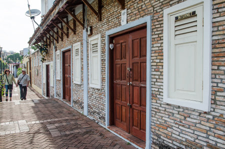 Malacca, Malaysia - June 15, 2014  Two tourists passing by the street along the river side of the Malacca Riverのeditorial素材