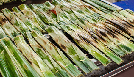 Otak-Otak is the traditional Malaysian local food  The fish meat and spices are wrapped inside a banana leaf and grilled it の写真素材