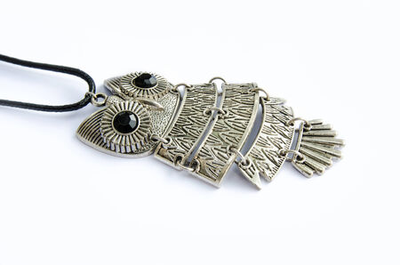 Owl necklace isolated on a white backgroundの写真素材