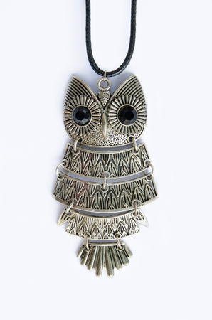 Owl necklace isolated on a white backgroundの写真素材