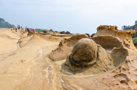 New Taipei City,Taiwan - March 15, 2015: Rock formation in Yehliu Geopark,Taiwan.People can seen exploring around it.のeditorial素材