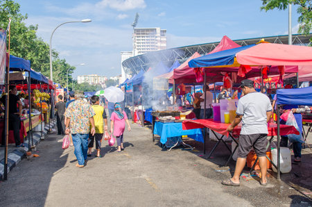 Kuala Lumpur,Malaysia - July 5, 2015: People seen walking and buying foods around the Ramadan Bazaar.It is established for muslim to break fast during the holy month of Ramadan.のeditorial素材