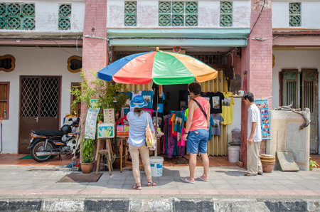 Georgetown,Penang - July 17,2015 : People can seen buying and exploring in front of souvenir stall in the street art in Georgetown, Penangのeditorial素材
