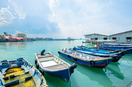 Penang,Malaysia - July 17,2015 : Boats at the Chew Jetty which is one of the UNESCO World Heritage Site in Penang.のeditorial素材