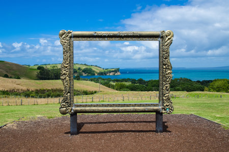 Auckland,New Zealand - February 14,2016 : A beautiful Shakespear Bay can seen  through the antique picture frame which is located in the Shakespear Regional Park, Auckland Region, New Zealandのeditorial素材